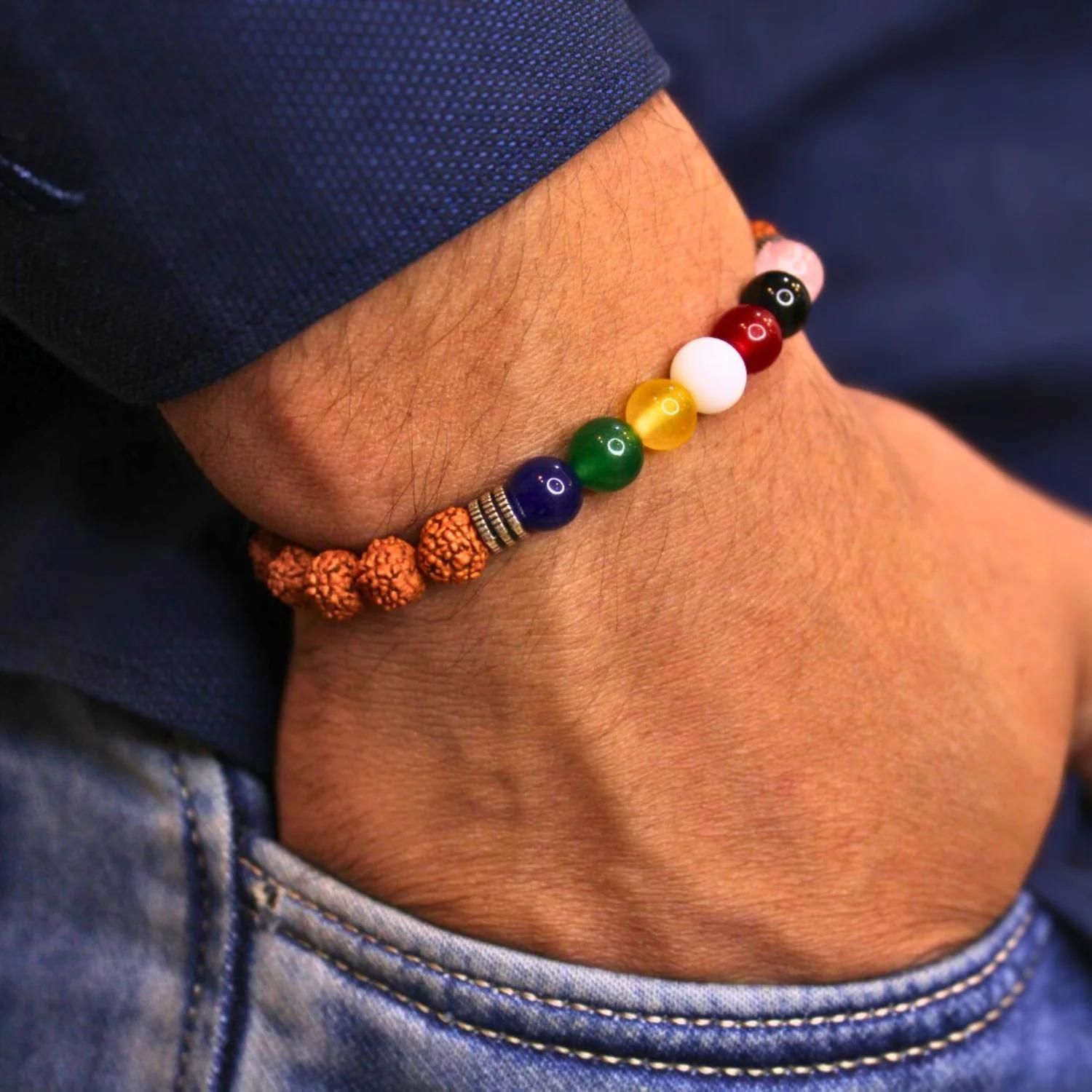 Multicolored beaded bracelet on a wrist with a blurred background